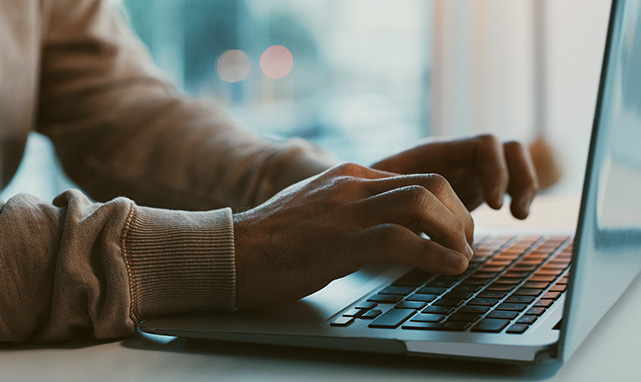 person on computer